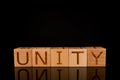 Teamwork concept, Wood cube block with word Ã¢â¬ÅUNITYÃ¢â¬Â. Royalty Free Stock Photo